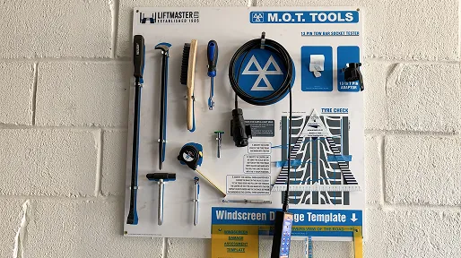 MOT tools board mounted on the workshop wall